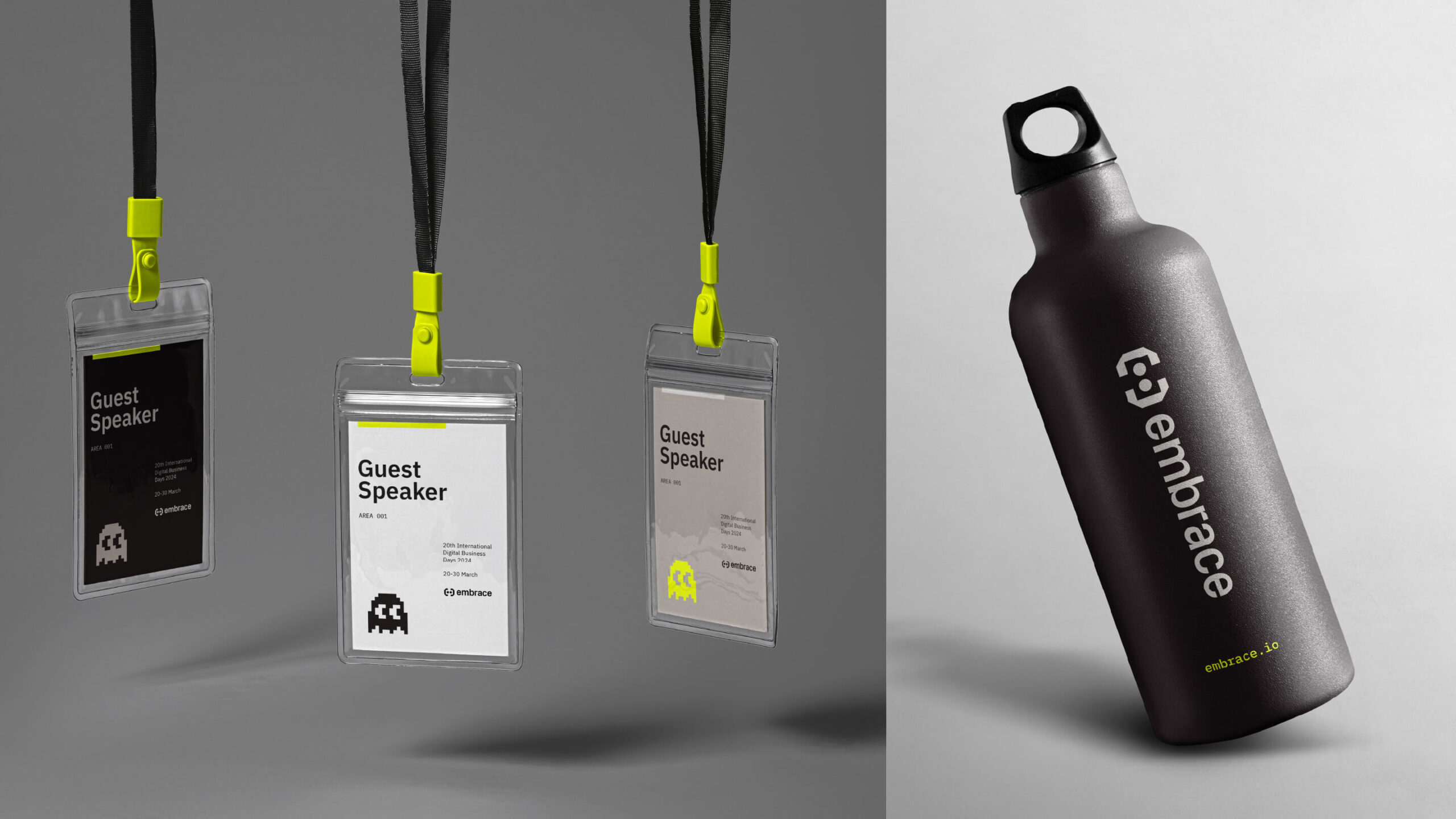 Photograph of with three Embrace guest speaker lanyards dangling from the top of a grey space of the left side of the image. They have bright yellow clasps where the lanyard meets the hanging loop. On the right is a photograph of a black water bottle in a white space that has the Embrace logo running horizontally on the the bottle. The water bottle is standing upright but tilted to the left.